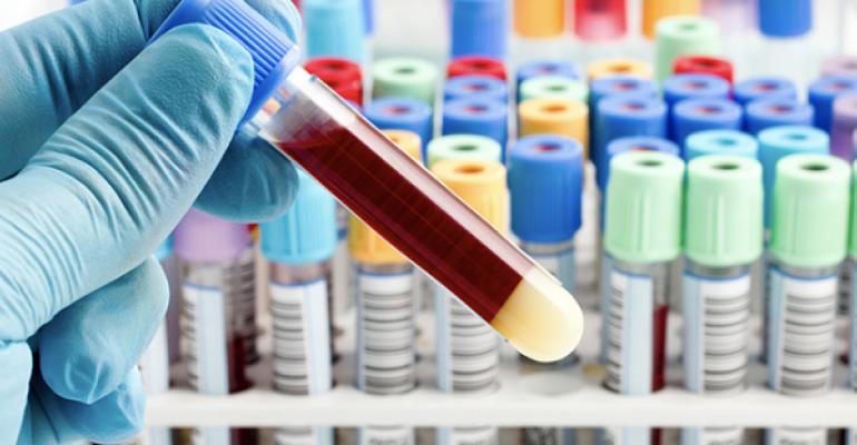 blood inside a test tube being held