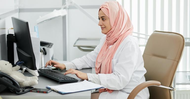 female-doctor-using-computer-in-clinic.jpg