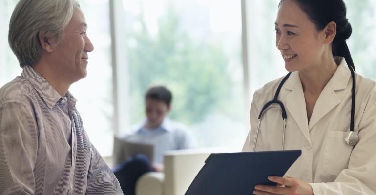 female-doctor-with-middle-aged-male-patient.jpg