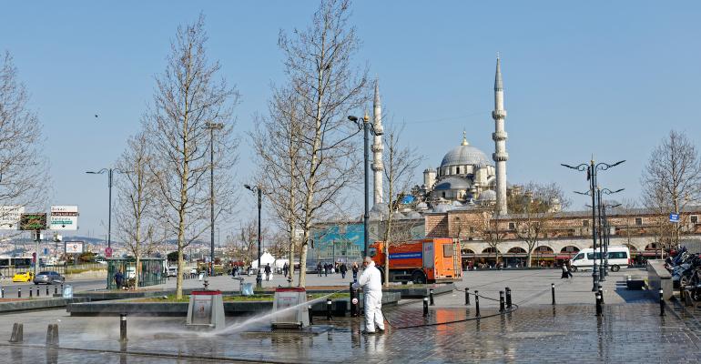 man-in-hazmat-suit-sterilising-street-in-Istanbul.jpg