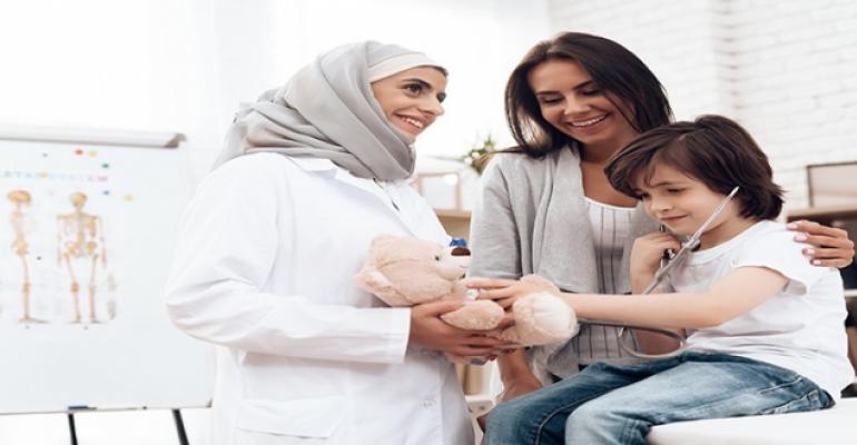 mother and daughter talking to a doctor