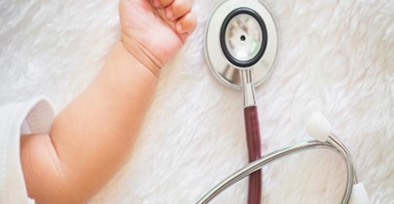 stethoscope besise a baby arm