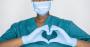 nurse-in-gloves-making-heart-gesture.jpg